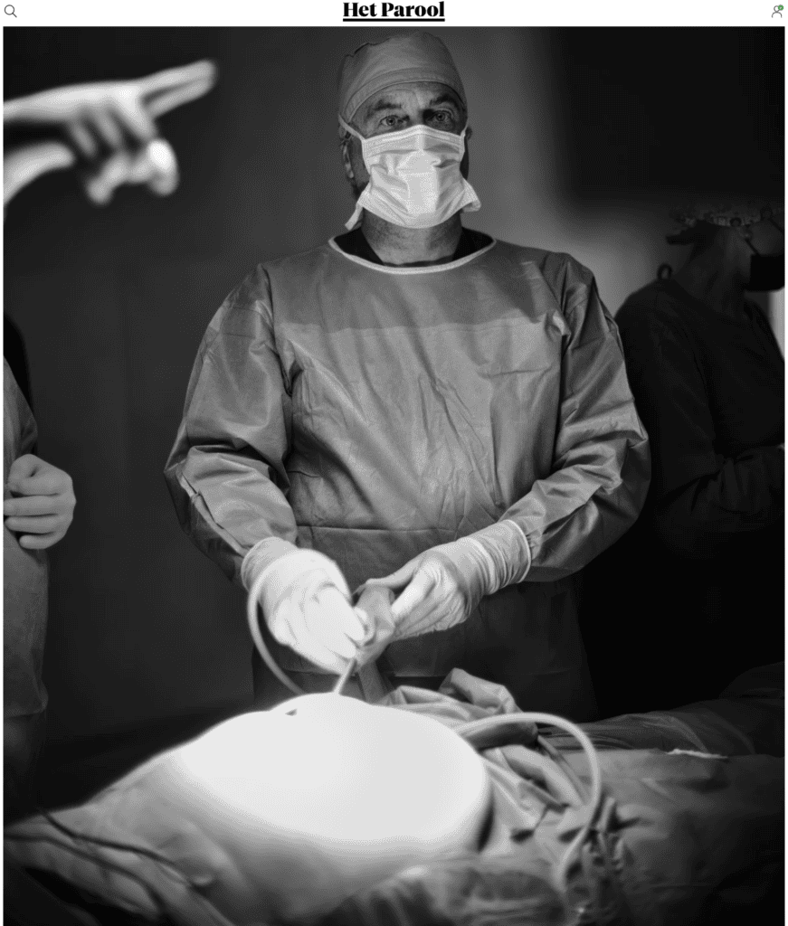 Surgeon performing an operation in a medical facility, demonstrating the urgent need for medical support.