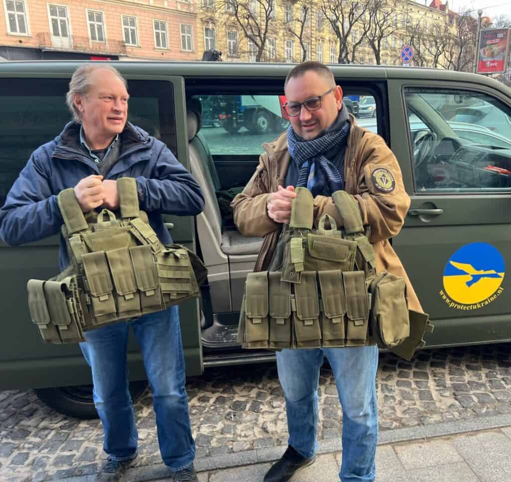 Protect Ukraine volunteers delivering helmets and protective vests.